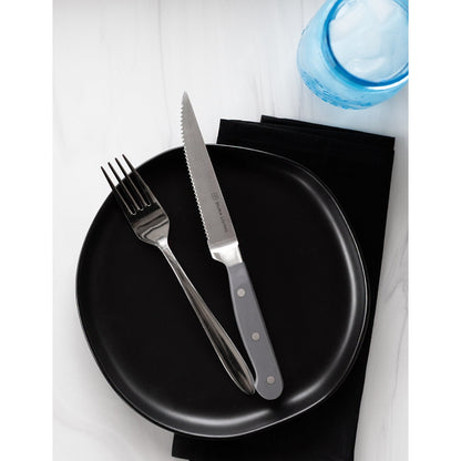 Set of four gray Dura Living steak knives with sleek handles, perfect for cutting steaks and meats.