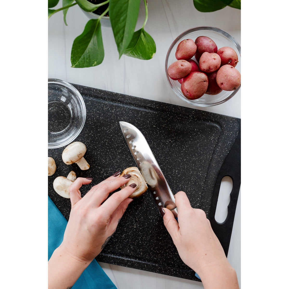 Dura Living Superior 7-inch gray Santoku knife with a sharp blade, ideal for slicing and chopping in the kitchen.
