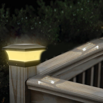 Solar garden light outdoors illuminating a garden path at dusk