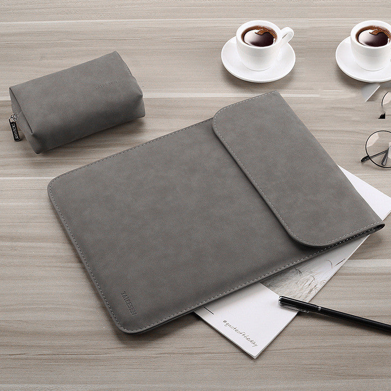 Black laptop bag with padded compartment and adjustable shoulder strap viewed from the front