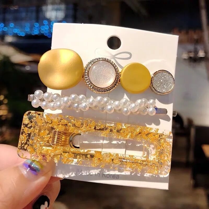 Pearl hair accessories in elegant designs, displayed together