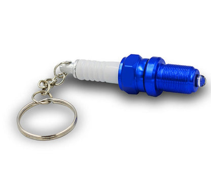 LED light spark plug keychain with compact metallic spark plug design and attached key ring