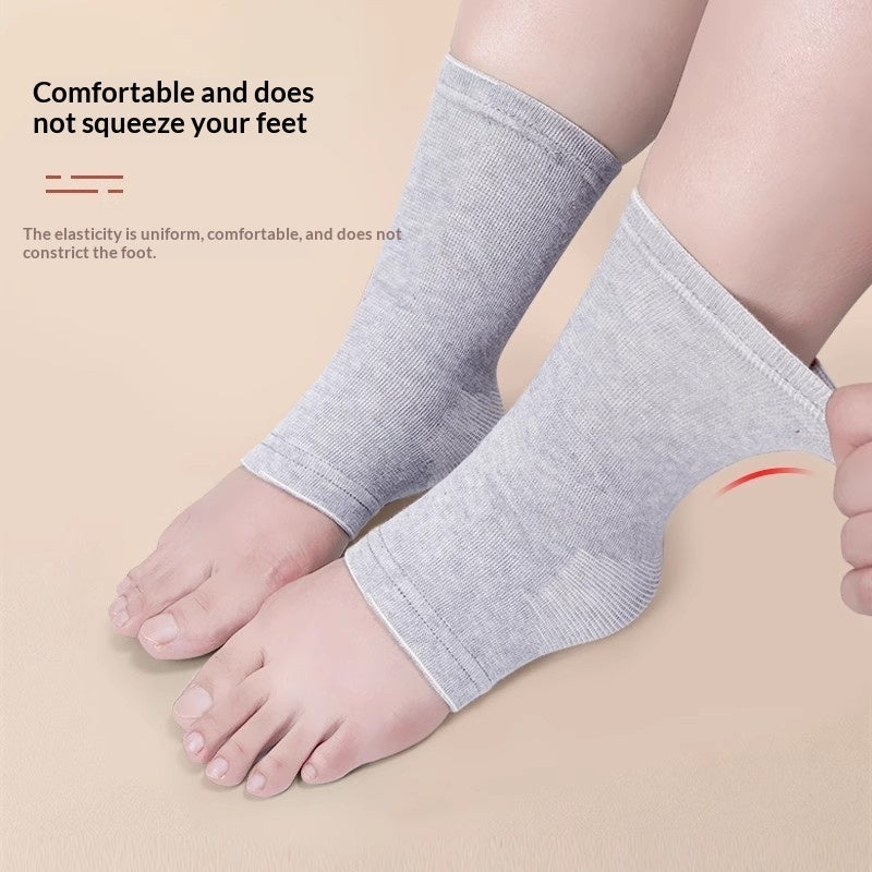 Women's ankle support sleeve socks for joint protection and warmth, black pair displayed flat