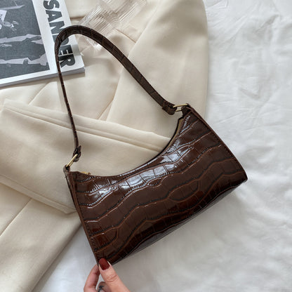 Women's small shoulder and underarm bag from BACKUPMYFILESNOW® with minimalist design and compact size.