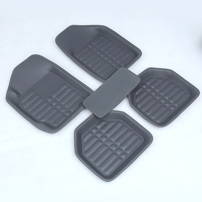 Car mat with textured surface and fitted edges for vehicle floor protection