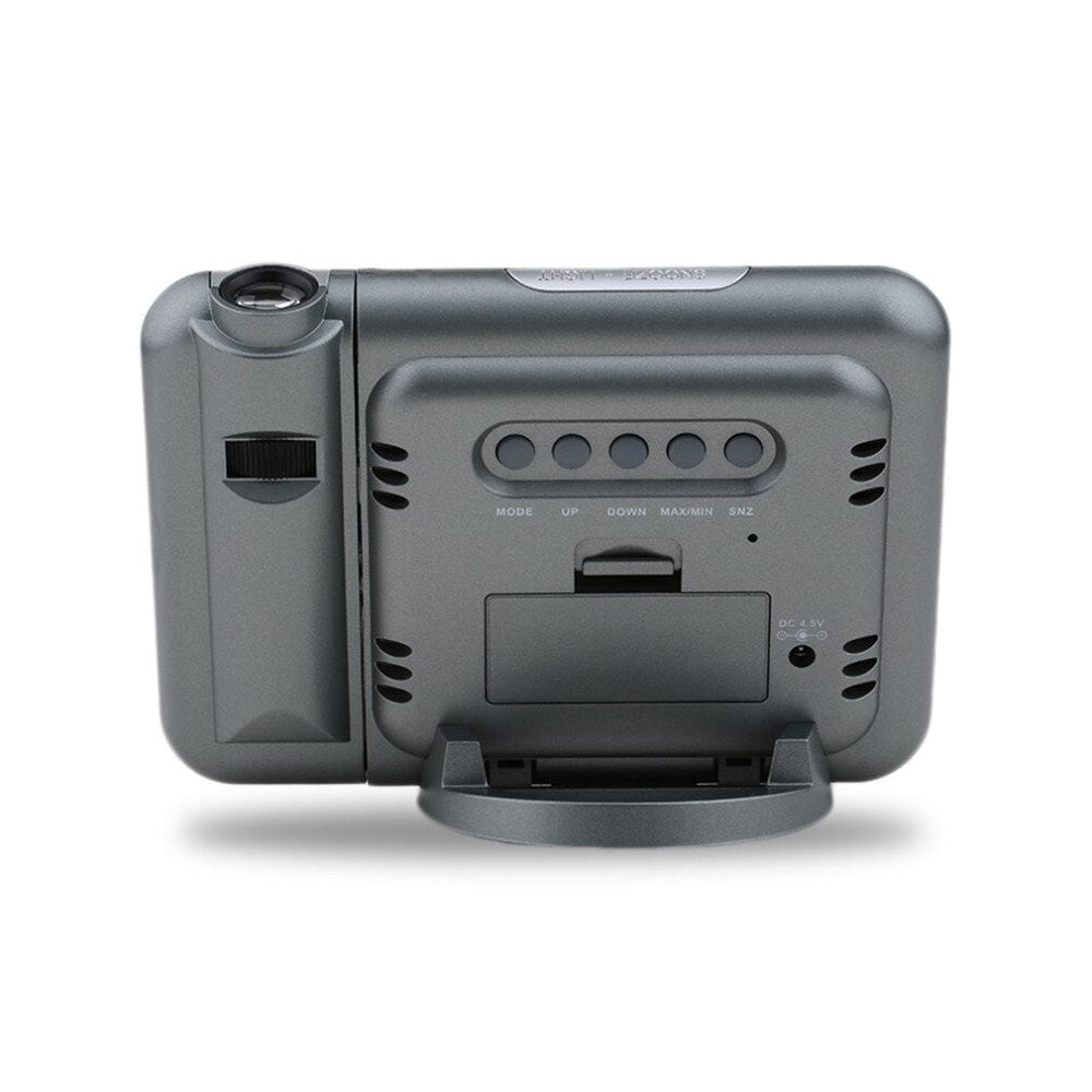 Black digital projection alarm clock with illuminated time display and compact rectangular design