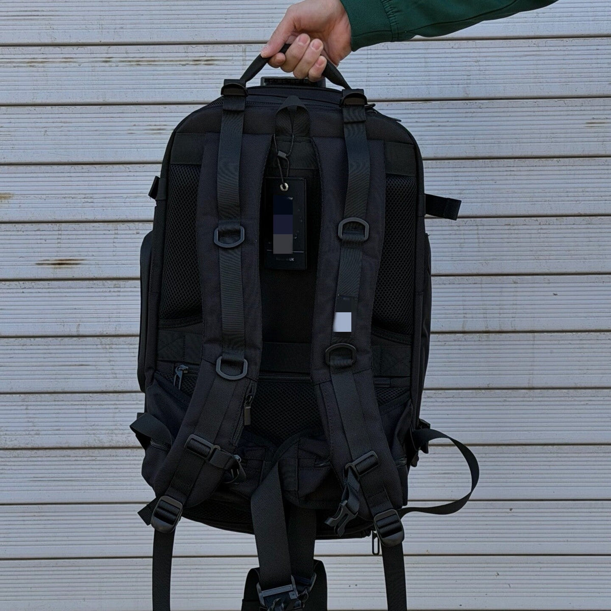 Men's multi-functional backpack with dual shoulder straps, black exterior and multiple zippered compartments