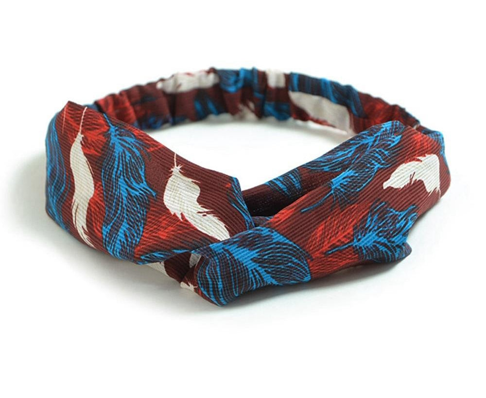 Women's retro style printed headband with colorful pattern, shown against a plain background