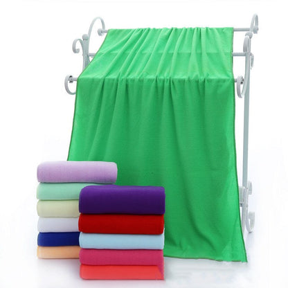 Absorbent microfiber bath towels in a soft, textured weave folded neatly for display