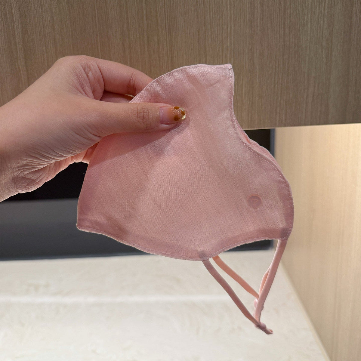 Lightweight linen Tencel breathable sun-protective mask in neutral fabric, shown from the front