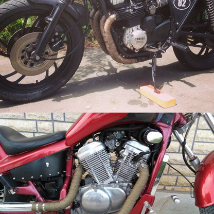 Motorcycle exhaust pipe insulation belt close-up.