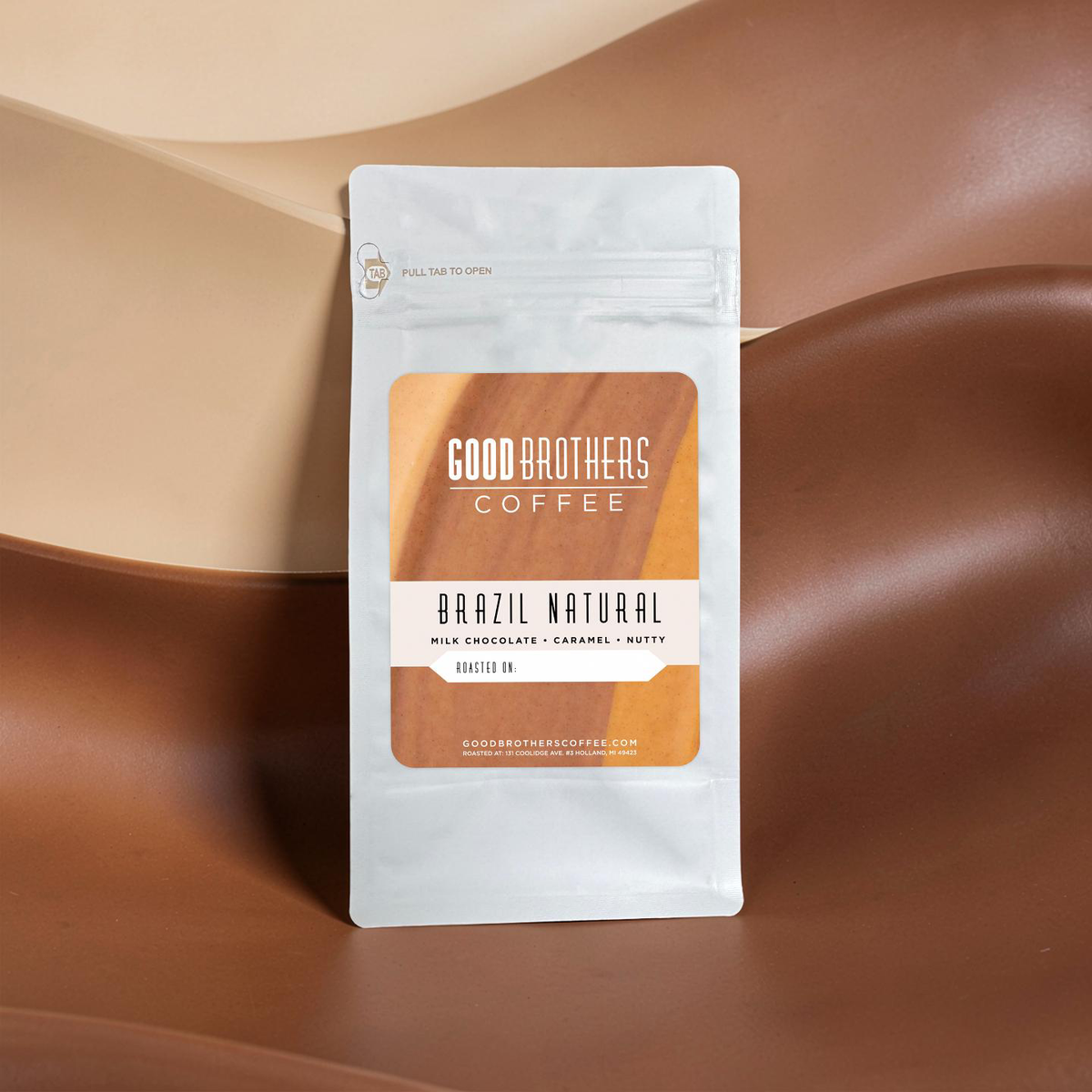 Roasted Brazil Serra Negra coffee beans by Good Brothers Coffee LLC, showing dark, glossy coffee beans on a neutral background.