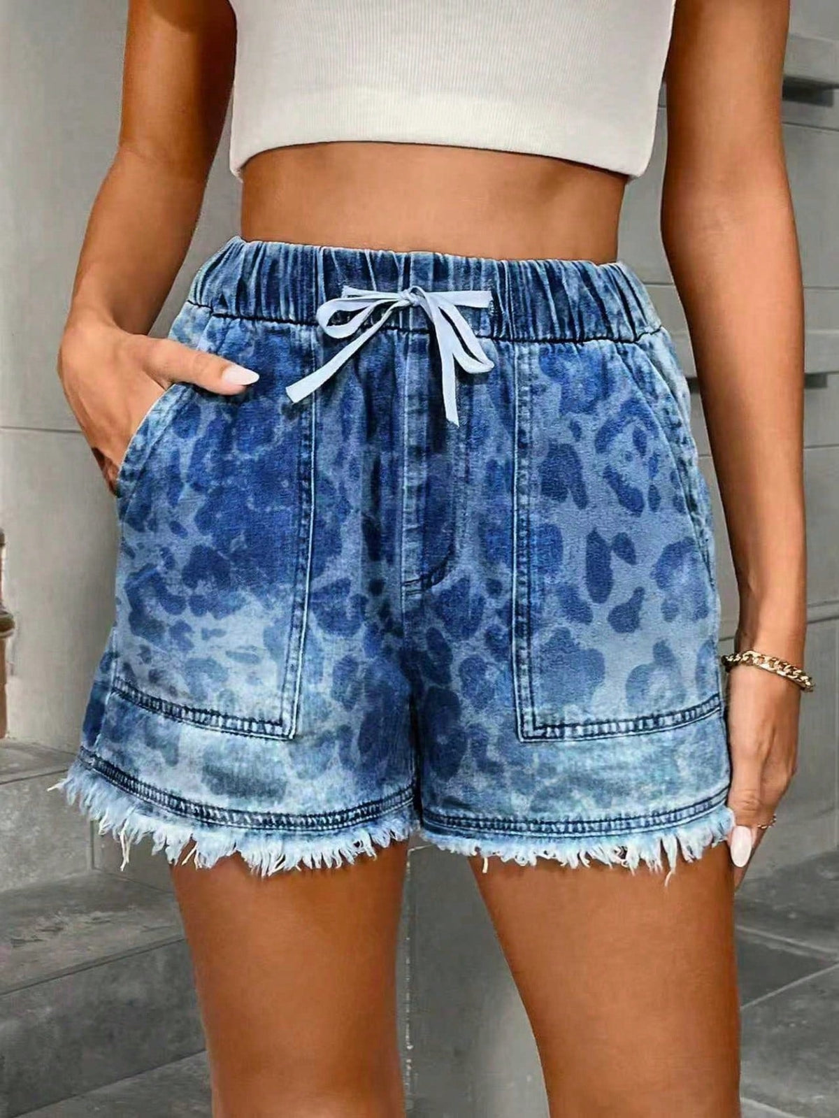 Women's denim shorts with elastic waist and drawstring waistband, front and back view