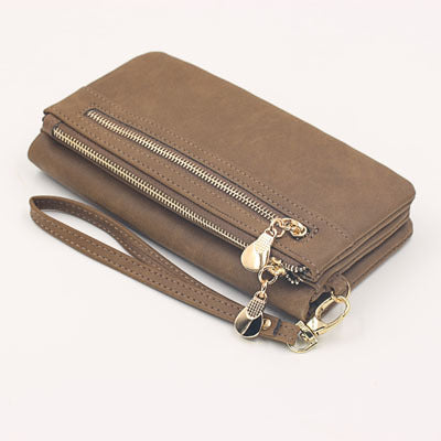 Urban style Chic women's long wallet by BACKUPMYFILESNOW® featuring multiple card slots and a sleek leather design.