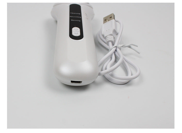 Electric ultrasonic facial beauty device with handheld skincare wand and smooth white design