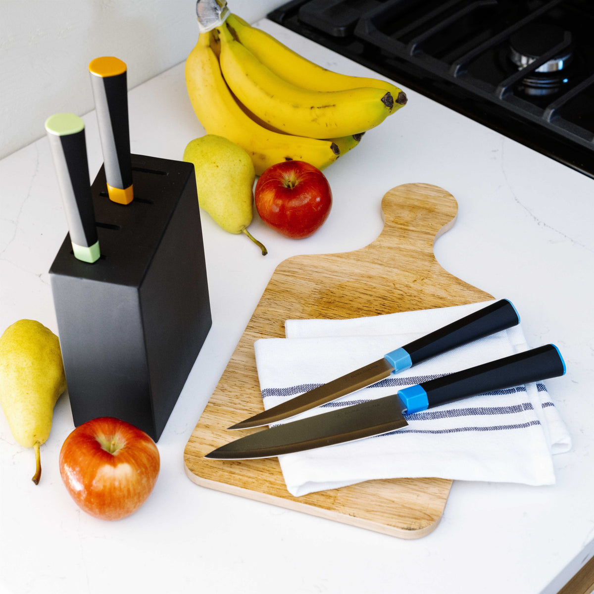 Dura Living Artistic Edge 5-piece kitchen knife set in a wooden block, featuring various knives for cooking and food prep.