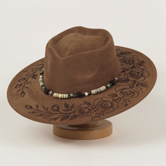 Western cowboy hat with embossed laser-engraved design and tall top hat crown