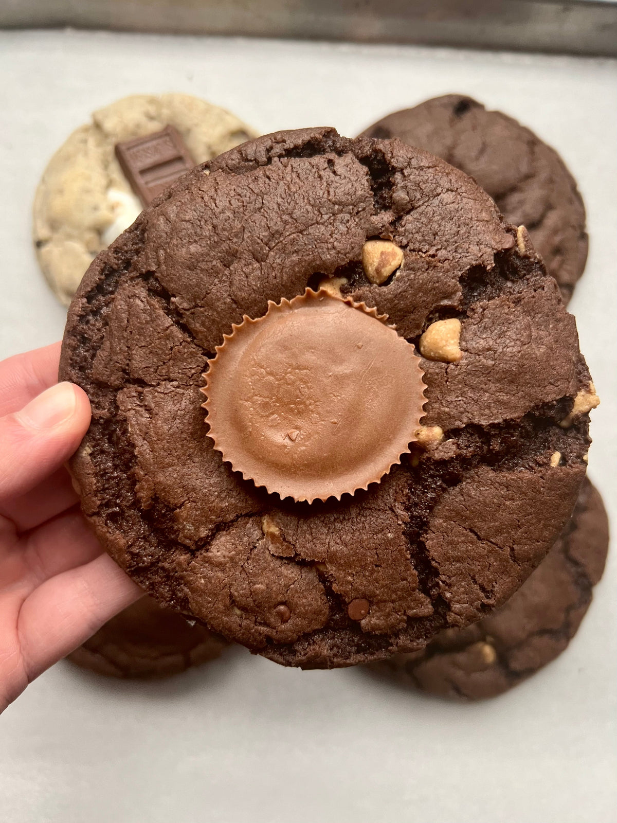 Let's Get Baked Artisan Desserts Reese's Brownie cookies with chocolate and peanut butter flavor, displayed on a plate.