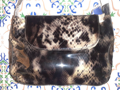 Handmade women's handbag with sturdy handles, featuring a stylish design perfect for everyday use.
