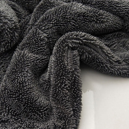 Microfiber absorbent car wash towel folded for vehicle cleaning, soft textured fabric visible