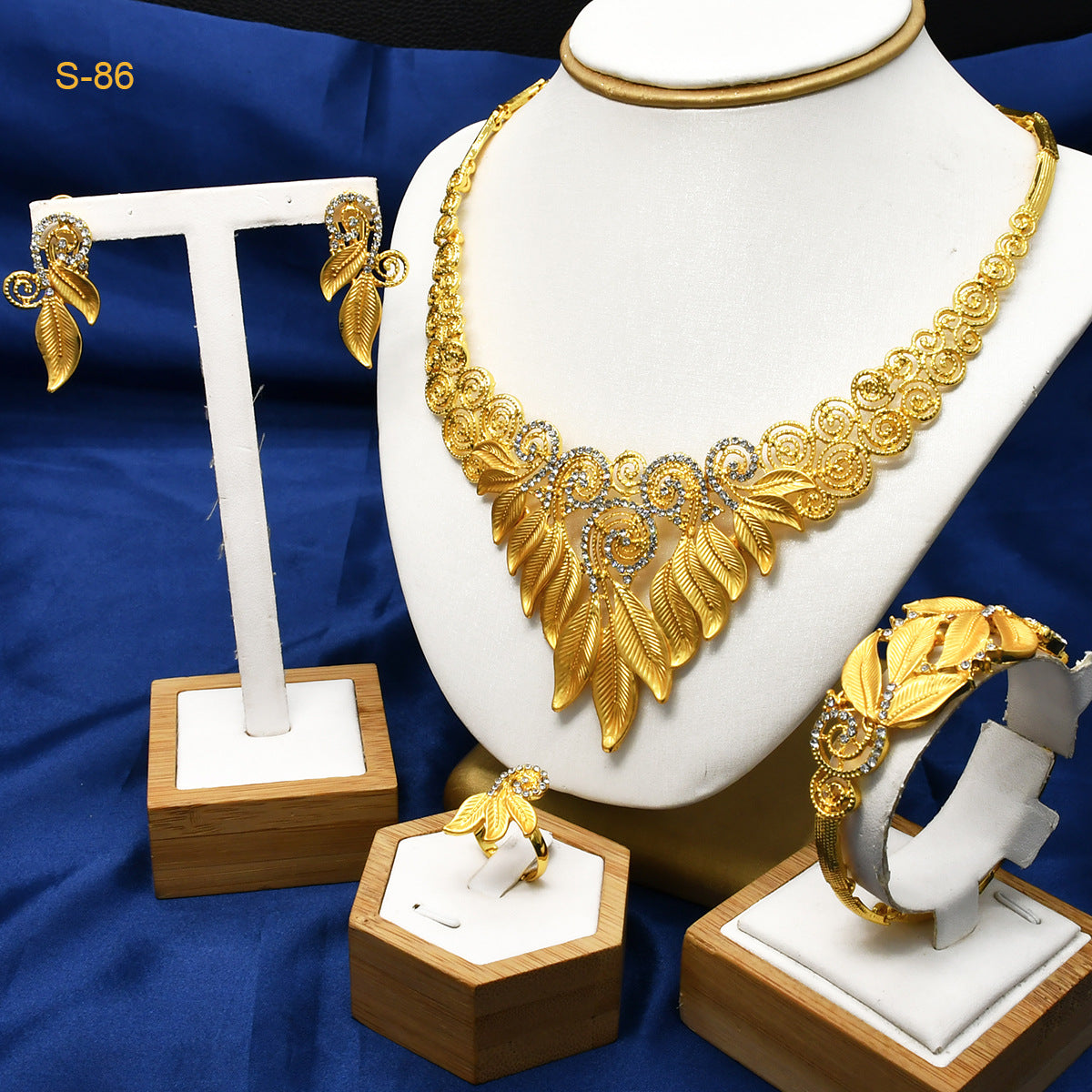Women's Saudi bridal necklace, bracelet, earrings and ring four-piece jewelry set in gold tone