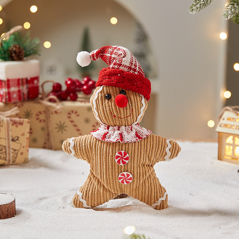 Gingerbread man Christmas ornaments with festive icing details and red accents displayed together