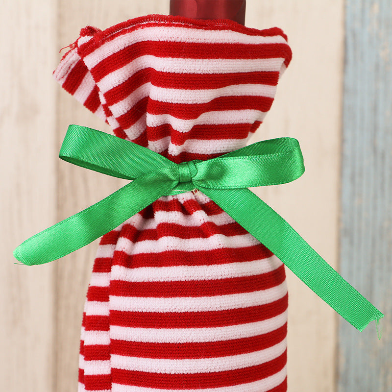 Striped Christmas wine bottle decorations set with festive red, green, and white holiday patterns