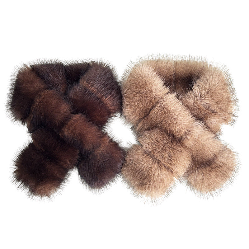 Segmented wool patches and plush materials cross-knitted into a mature, elegant coat with fur trim