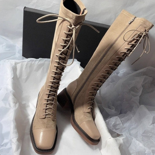 Stitched round-toe lace-up high-top women's boots in a classic ankle-high design