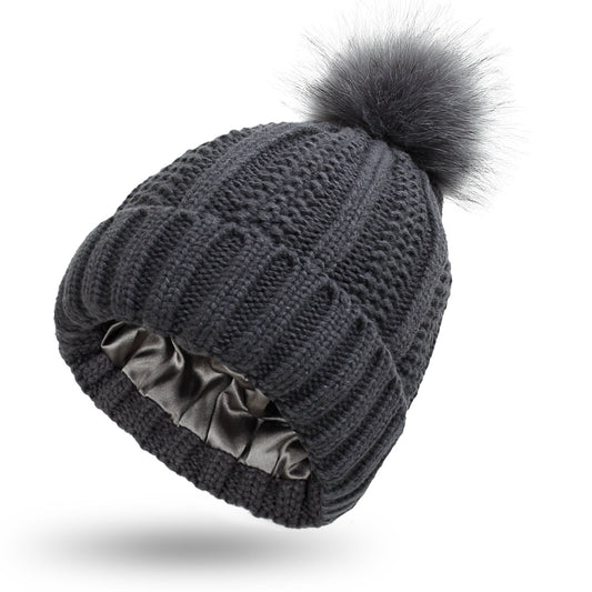 Women's winter knitted beanie hat with faux fur pom pom, stretchy lined skull cap in a neutral color