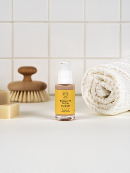 BelleVie Cosmétiques tinted mineral sunscreen SPF 30 in a 5oz container, providing daily UV protection with a natural glow.