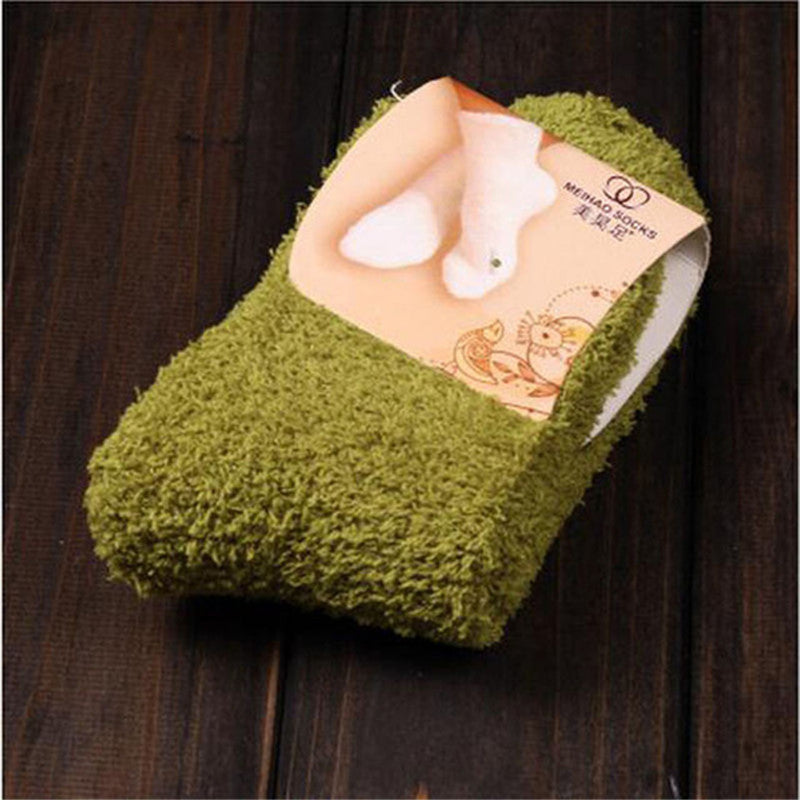 Warm feet on bed wearing household warm socks; My Store brand cozy foot covering