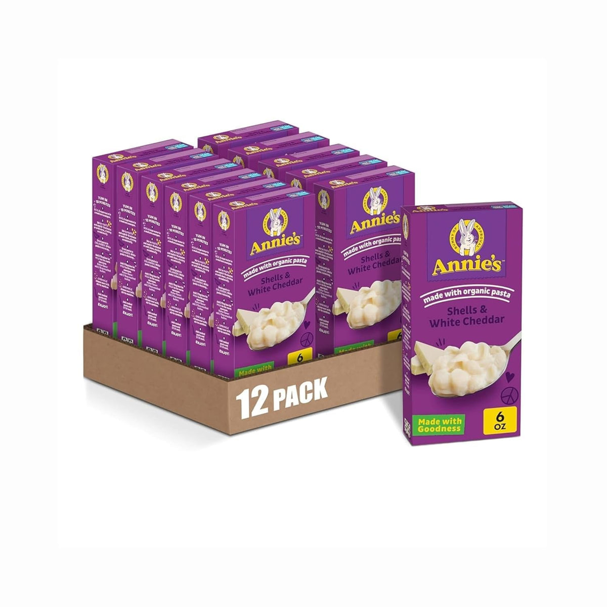Packaged Annie's Homegrown Shells & White Cheddar organic mac and cheese, 4-count box with creamy cheese sauce and pasta shells