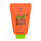 Nate's Organic Honey in a 16oz squeeze bottle with golden honey flowing from the nozzle.