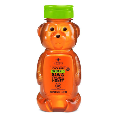 Nate's Organic Honey in a 16oz squeeze bottle with golden honey flowing out, showcasing natural, pure organic honey.