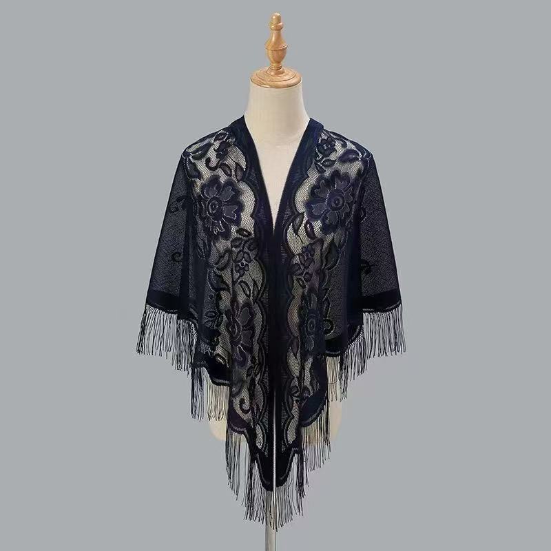 Women's breathable lace triangle shawl with floral design, shown in detail