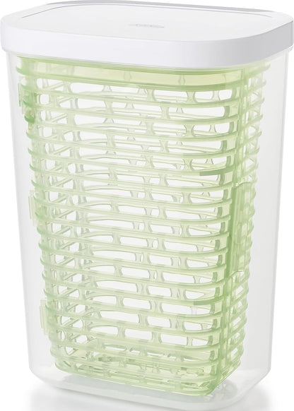 Large white OXO Good Grips GreenSaver produce keeper for storing fresh fruits and vegetables in the kitchen.