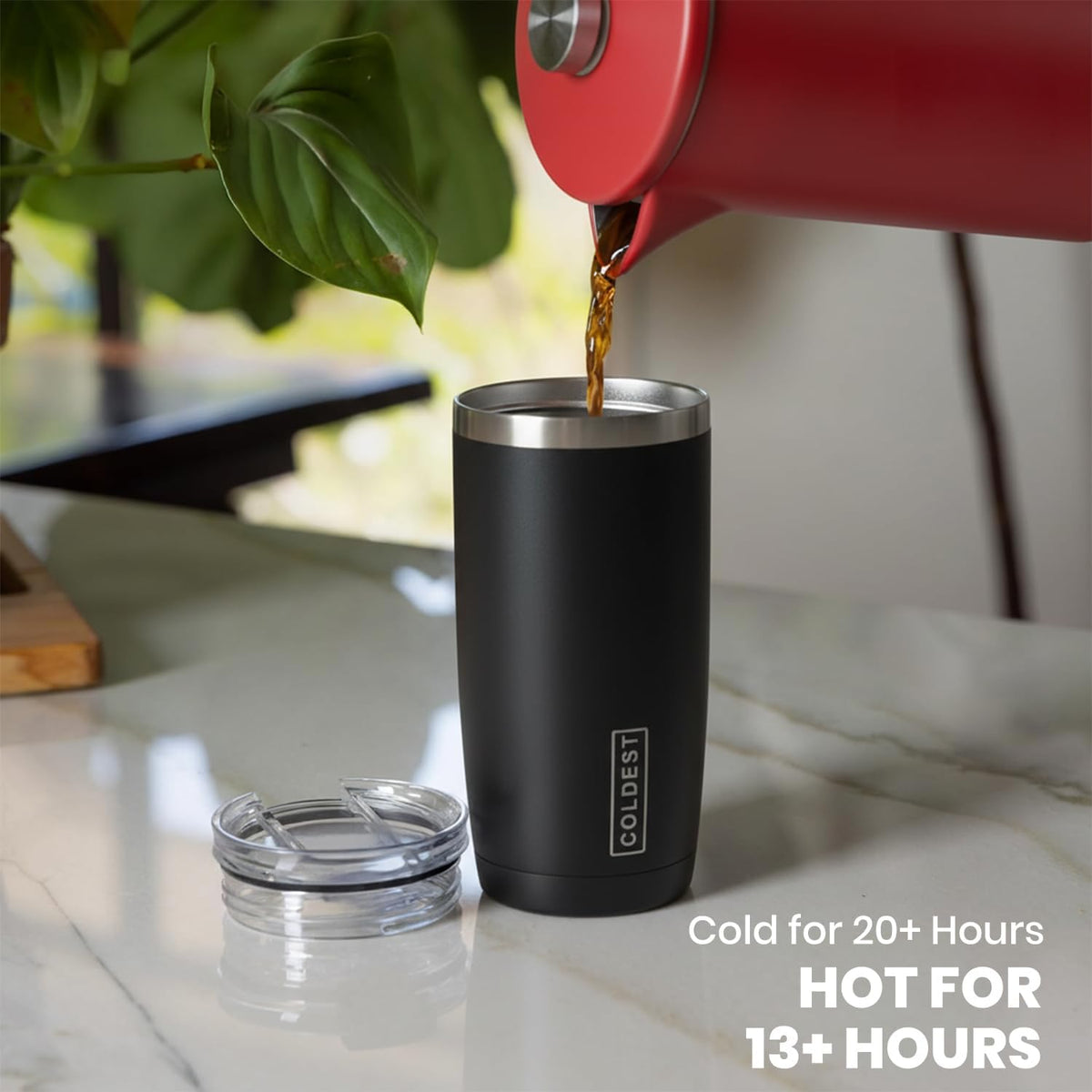 Coldest 20 oz Tumbler v2 hydration bottle with stainless steel body, black lid, and clear body for beverages, outdoor use.