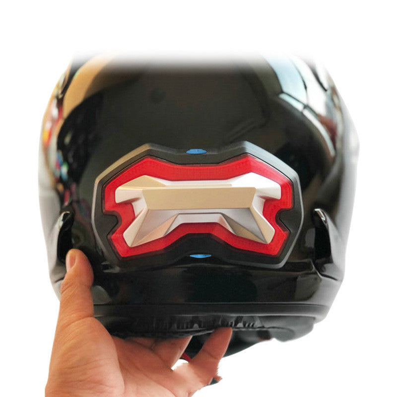 Helmet restraint battery and turn signal light assembly with visible wiring and mounting components
