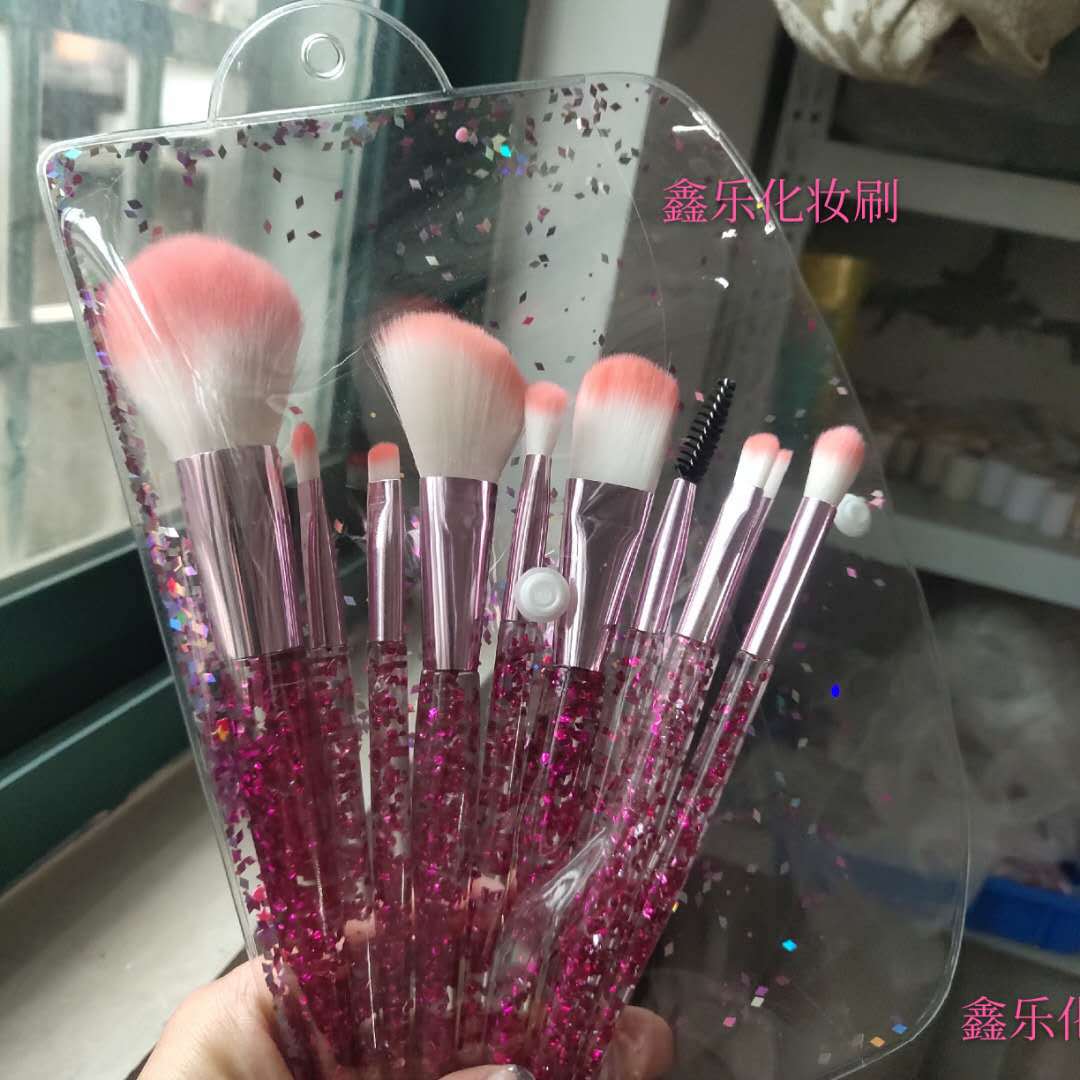 Set of 10 essential makeup brushes from BACKUPMYFILESNOW® in various sizes with black handles and soft bristle heads for makeup application.
