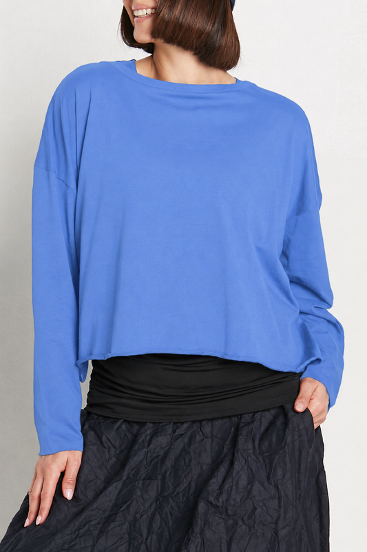 Model wearing a PLANET by Lauren G Pima Cotton Mini Luxury Boxy T-Shirt in cornflower blue, showing the relaxed fit and soft fabric.
