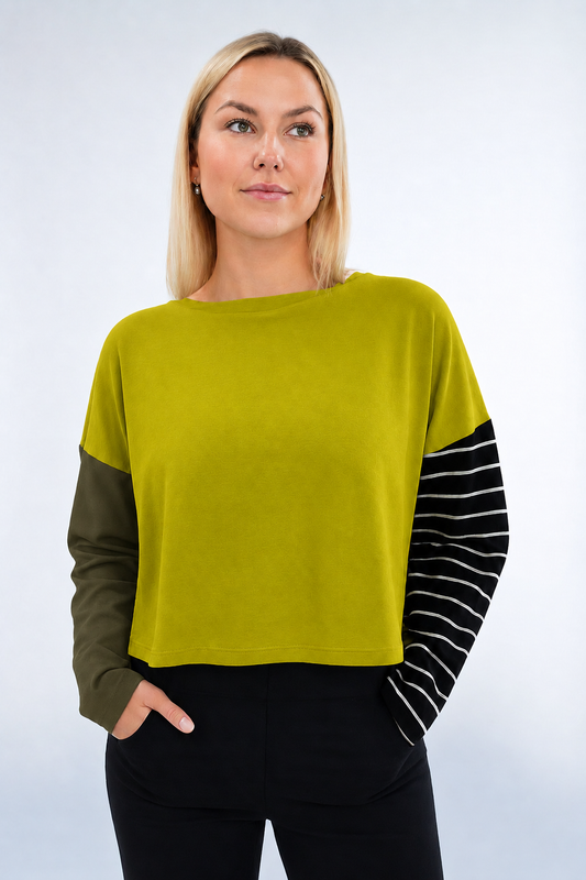 Model wearing PLANET by Lauren G Pima cotton mixed media mini luxury boxy T-shirt in guacamole color.