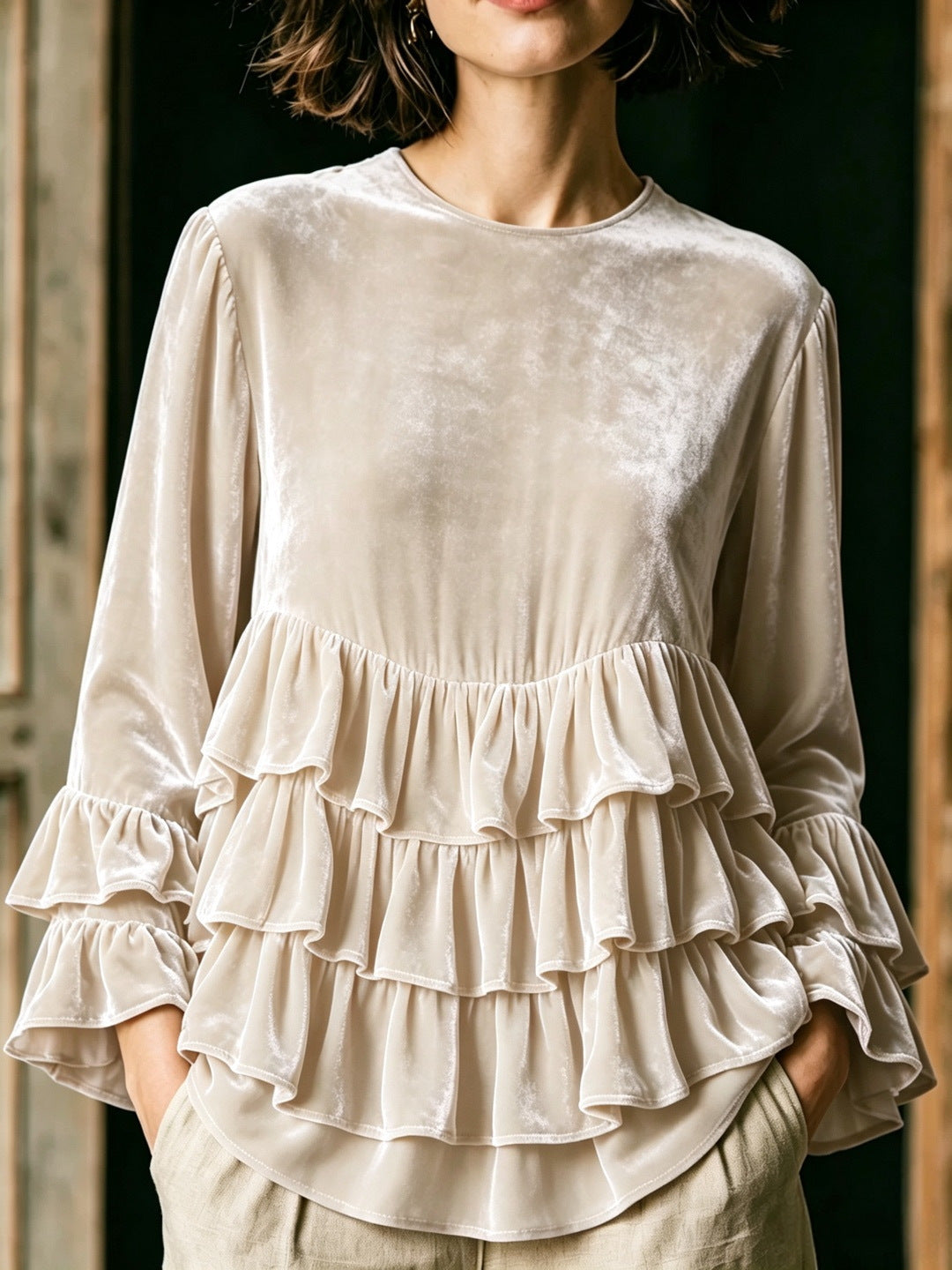 Women's solid-color long-sleeve crew-neck top with ruffle trim and loose fit