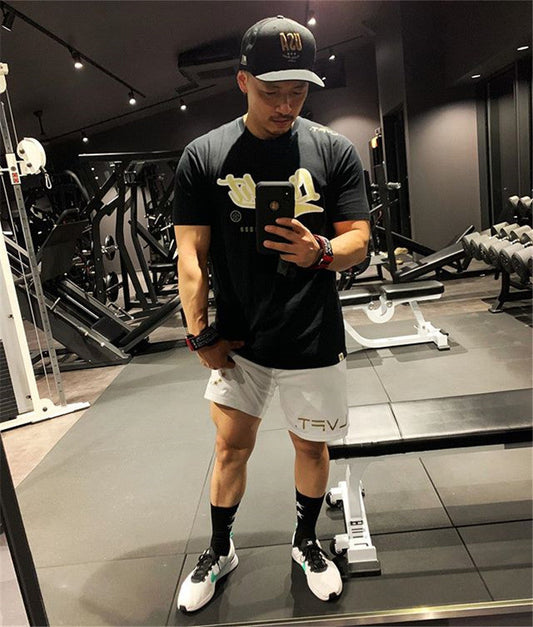 Men's mesh quick-dry running training shorts with breathable quarter-length design