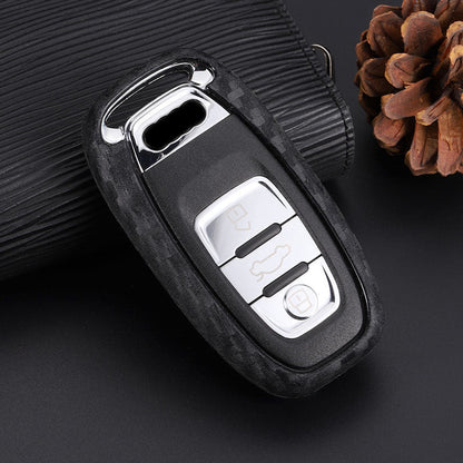 Carbon fiber silicone car key case with textured finish and secure key fob fit