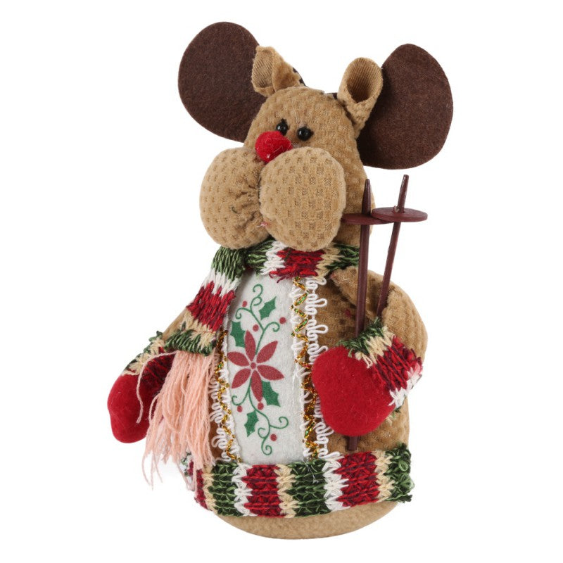 Christmas elk, Santa Claus, and snowman decorations displayed together for holiday decor