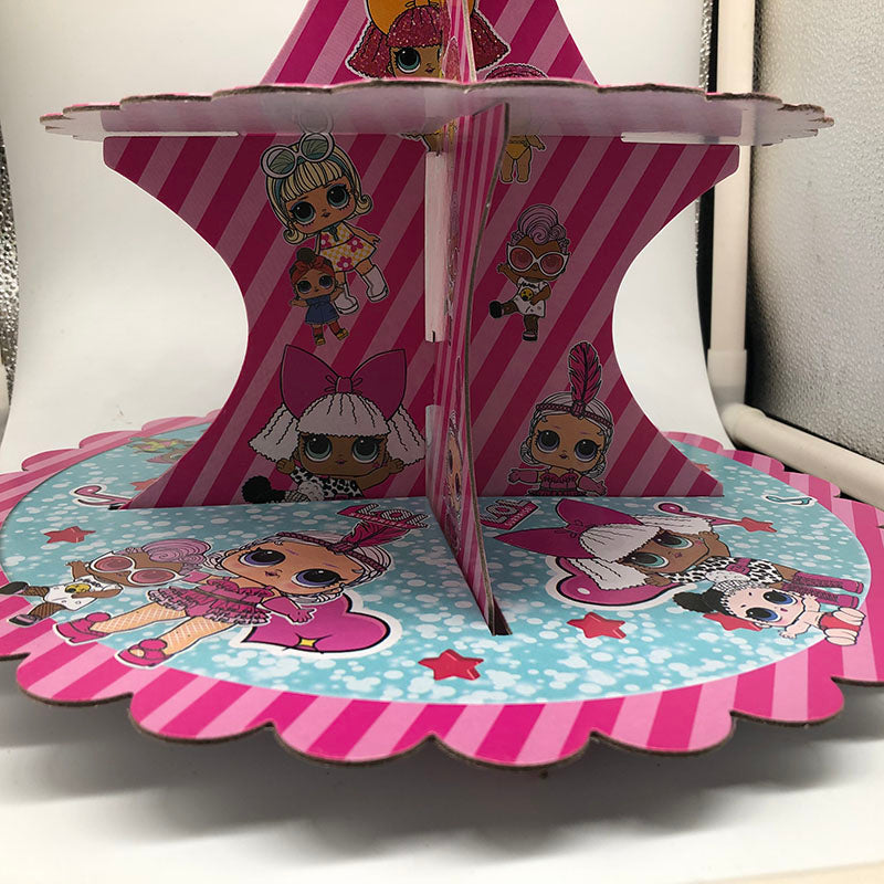 Cartoon doll birthday theme cake stand with colorful party decorations in pink and pastel tones