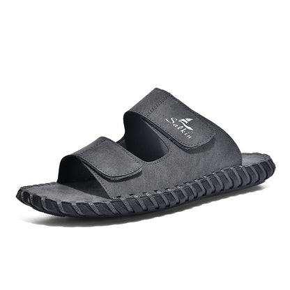 Men's casual outdoor leather slippers in a simple slip-on design with open back and durable sole