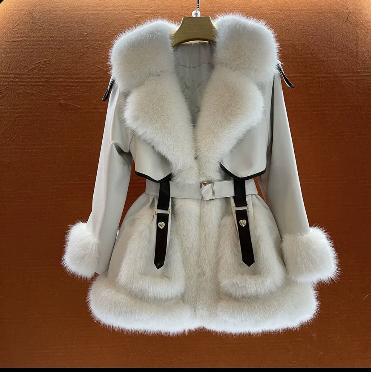 Elegant women's fur coat with oversized fur collar in a classic silhouette