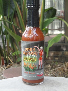 Cinderosa Ranch Devil's Lightning Bhut Jolokia ghost pepper hot sauce bottle with fiery red sauce inside.